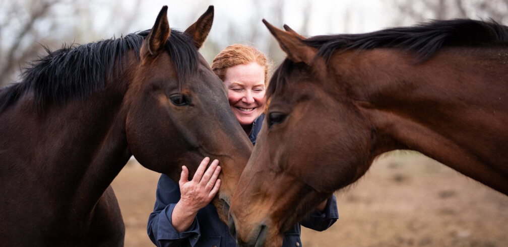 Amy with two horses