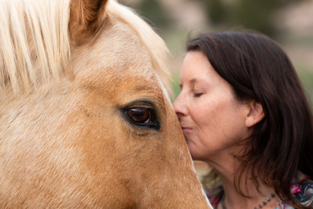 Close up of Andree kissing horse